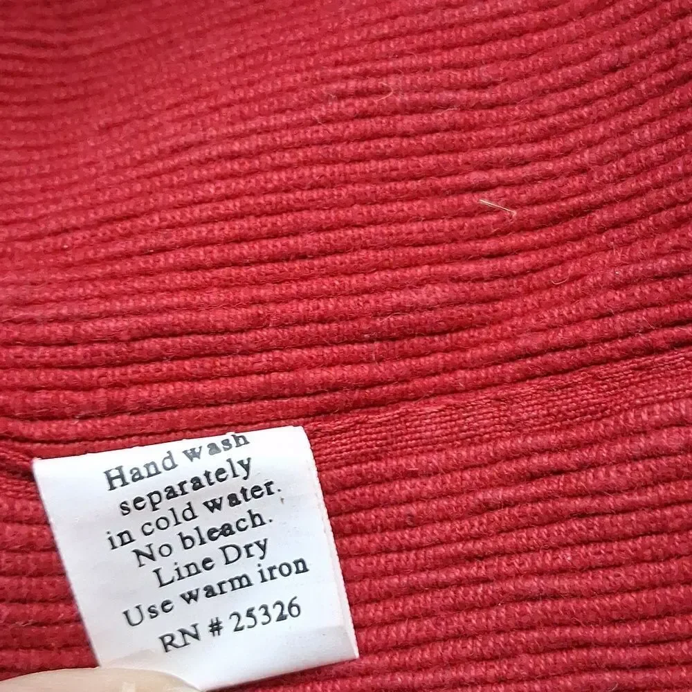 Set of 7‎ red corduroy placemats.